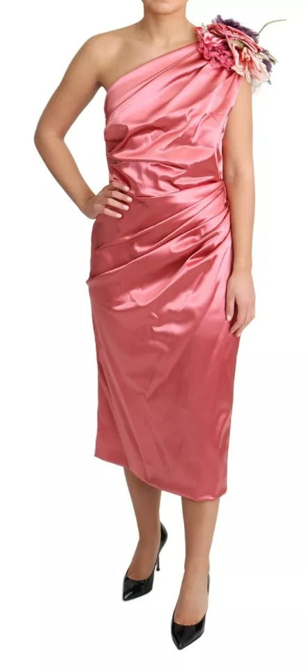 Experience the allure of the Dolce & Gabbana Pink Draped Midi Flower Applique Dress, where exquisite craftsmanship and luxurious materials redefine elegance for any sophisticated occasion.
