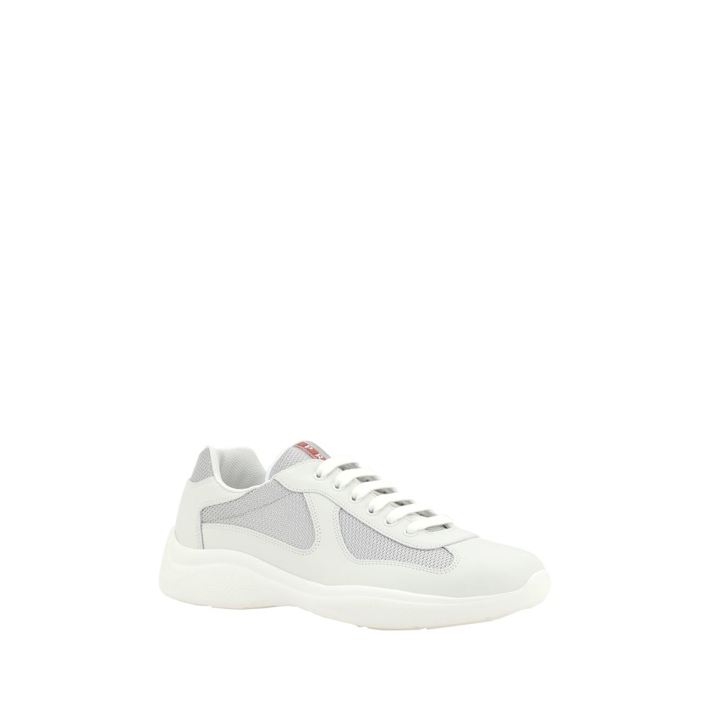 Experience the allure of Prada's White Calf Leather Bos Taurus Low Top Sneakers, where exquisite craftsmanship meets luxurious comfort for the discerning individual.