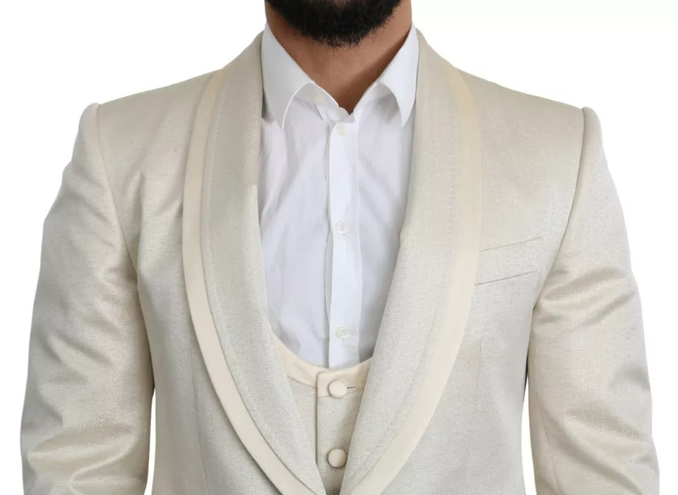 Experience the allure of the Dolce & Gabbana Beige Wool Crème 3 Piece SICILIA Shawl Suit, a masterpiece of Italian craftsmanship that embodies timeless elegance and sophistication.