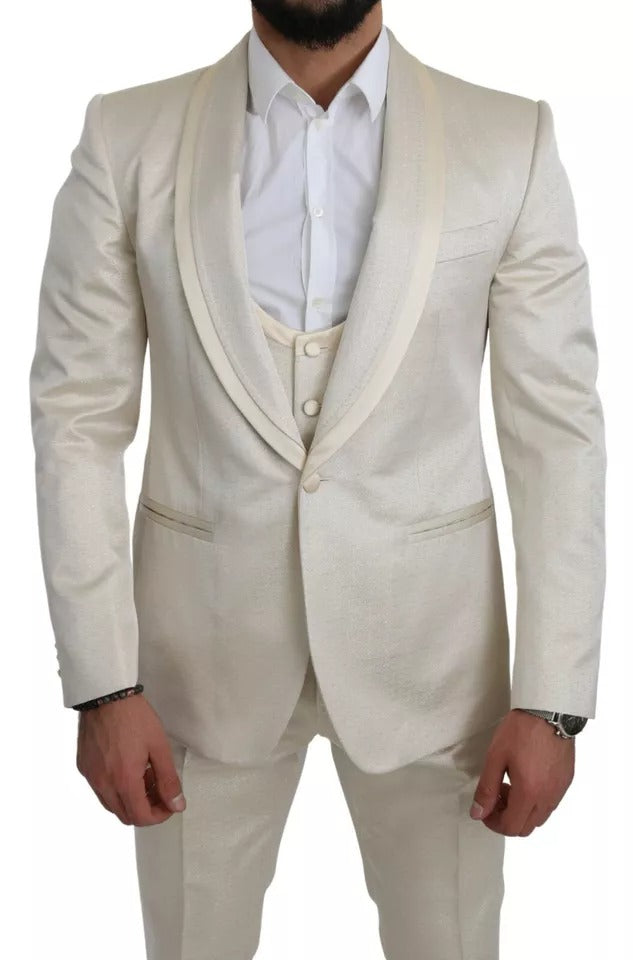 Experience the allure of the Dolce & Gabbana Beige Wool Crème 3 Piece SICILIA Shawl Suit, where exquisite Italian craftsmanship meets timeless elegance for the discerning individual.