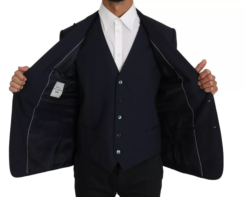 Discover the Dolce & Gabbana Blue Wool MARTINI Blazer Vest 2 Piece, a masterpiece of Italian craftsmanship, blending luxurious wool with refined elegance for the discerning individual.