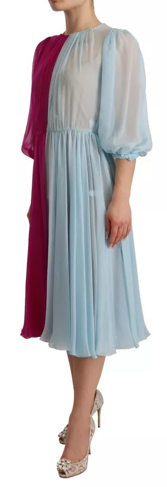 Indulge in the exquisite Dolce & Gabbana Fuchsia Light Blue Silk Two Tone Midi Dress, a masterpiece of Italian craftsmanship that embodies elegance and allure for any sophisticated occasion.