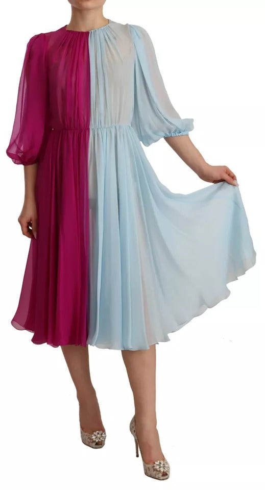 Indulge in the exquisite allure of the Dolce & Gabbana Fuchsia Light Blue Silk Two Tone Midi Dress, a masterpiece of Italian craftsmanship that elevates every occasion with its luxurious silk and elegant silhouette.