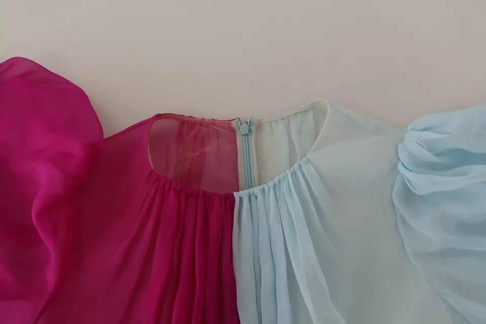 Discover the exquisite Dolce & Gabbana Fuchsia Light Blue Silk Two Tone Midi Dress, a masterpiece of Italian craftsmanship that embodies elegance and sophistication for any upscale occasion.
