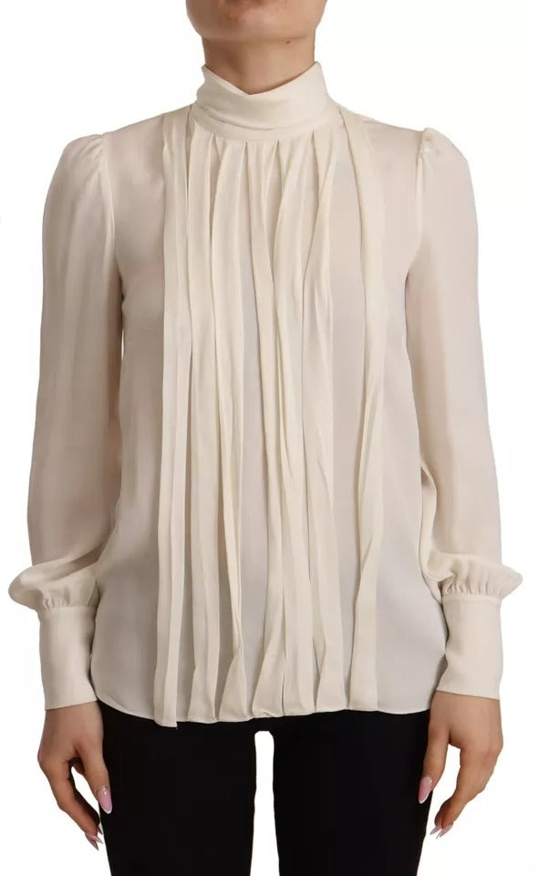 Indulge in the exquisite Dolce & Gabbana Off White Silk Long Sleeve Turtle Neck Top, a testament to Italian craftsmanship that elevates your elegance and allure.