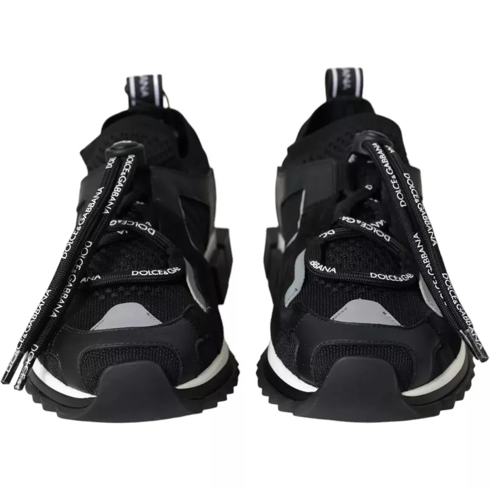 Experience the exquisite artistry of Dolce & Gabbana's Black White Logo Sorrento Sneakers, crafted in Italy from luxurious materials for a sophisticated lifestyle.