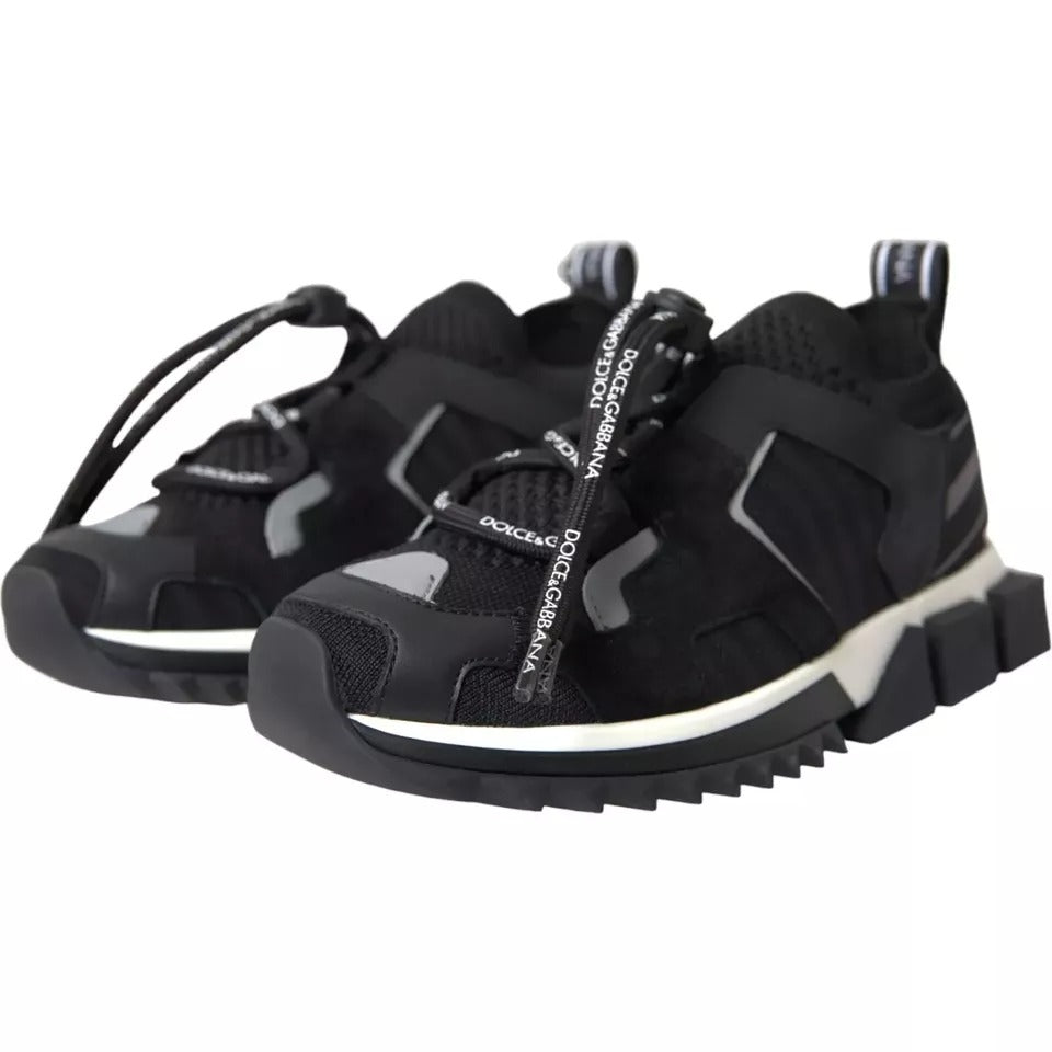 Elevate your style with Dolce & Gabbana's Black White Logo Sorrento Sneakers, where Italian craftsmanship meets luxurious comfort, perfect for the discerning individual.