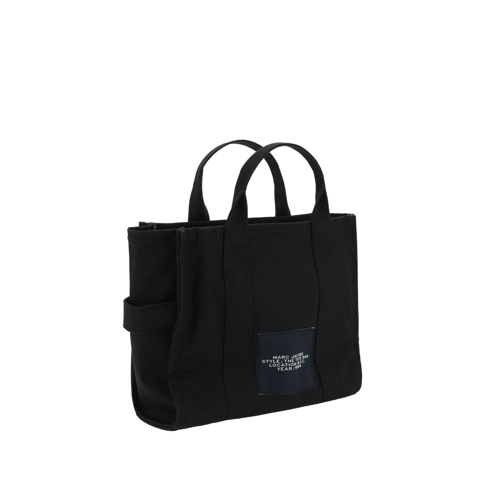 Indulge in the sophistication of the Marc Jacobs Black Cotton Handbag, a medium tote from the SS26 collection, crafted for those who embody effortless elegance and timeless luxury.