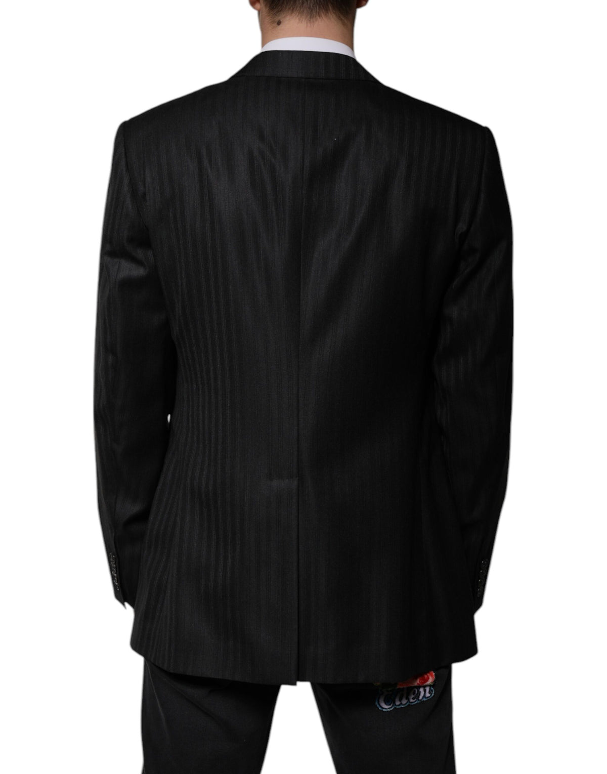 Elevate your wardrobe with the Dolce & Gabbana Black Stripe Wool Blazer, a masterpiece of Italian craftsmanship blending luxurious wool and silk for timeless sophistication.