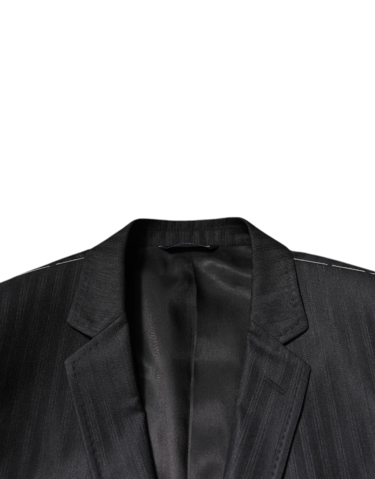 Elevate your wardrobe with the Dolce & Gabbana Black Stripe Wool Single Breasted Blazer, a masterpiece of Italian craftsmanship, blending luxury and sophistication for the discerning individual.