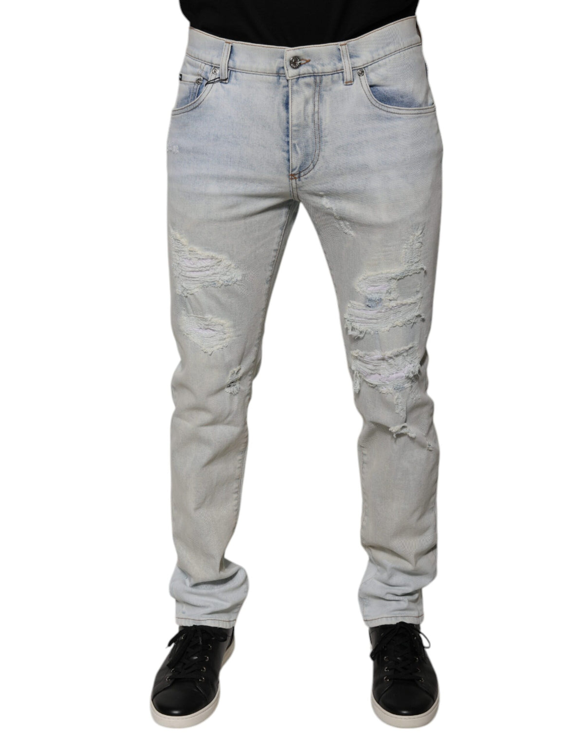 Experience the allure of Dolce & Gabbana's Light Blue Cotton Blend Tattered Skinny Denim Jeans, where Italian craftsmanship meets contemporary elegance for the discerning individual.