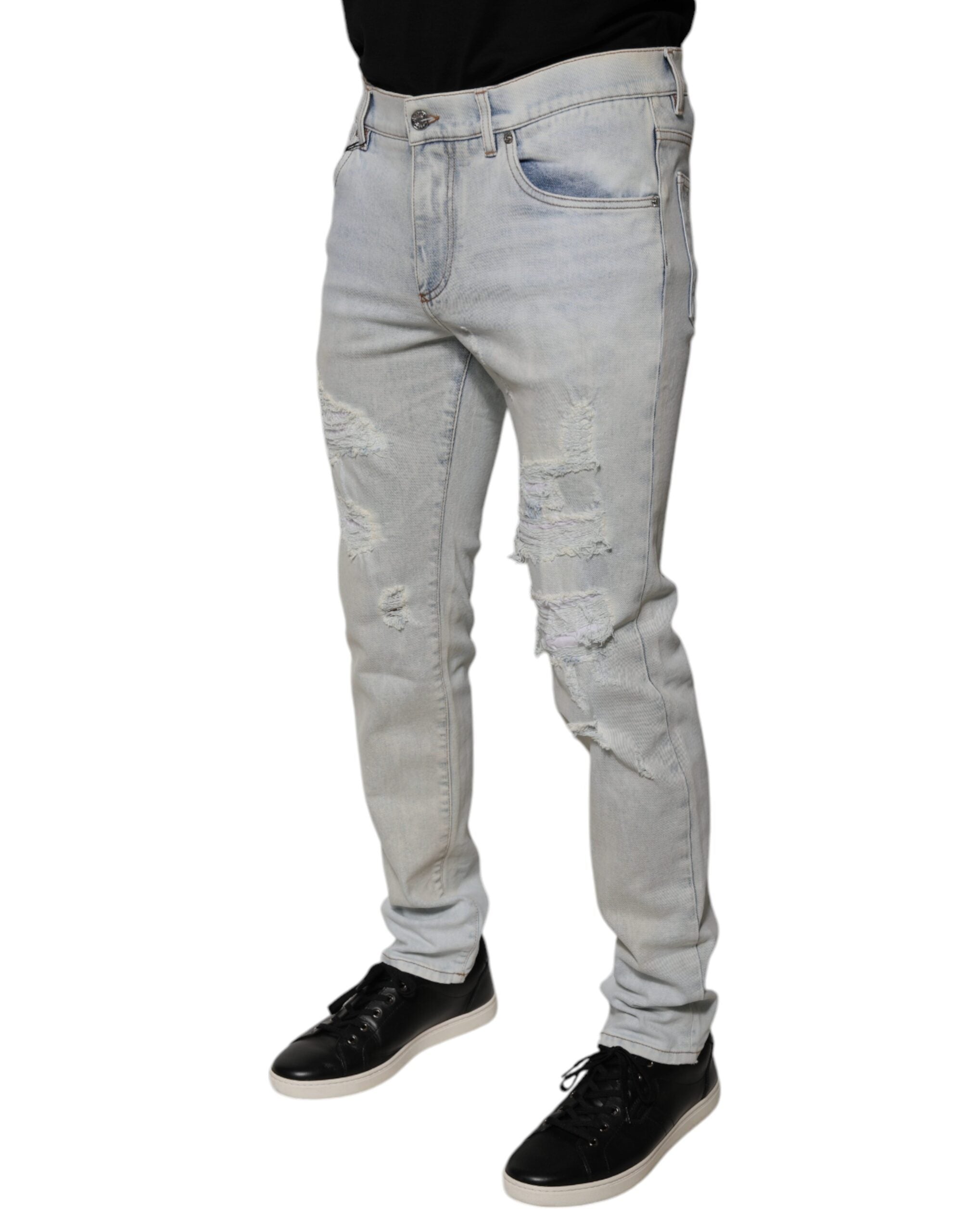 Indulge in the exquisite Dolce & Gabbana Light Blue Cotton Blend Tattered Skinny Denim Jeans, a luxurious blend of comfort and style, crafted for the discerning individual.