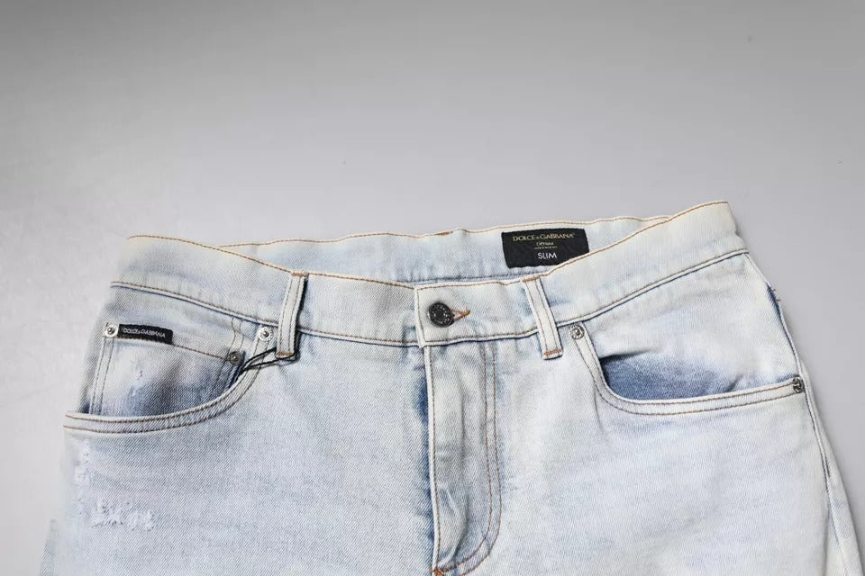 Indulge in the exquisite Dolce & Gabbana Light Blue Cotton Blend Tattered Skinny Denim Jeans, where Italian craftsmanship meets luxurious style, elevating your wardrobe with effortless elegance.