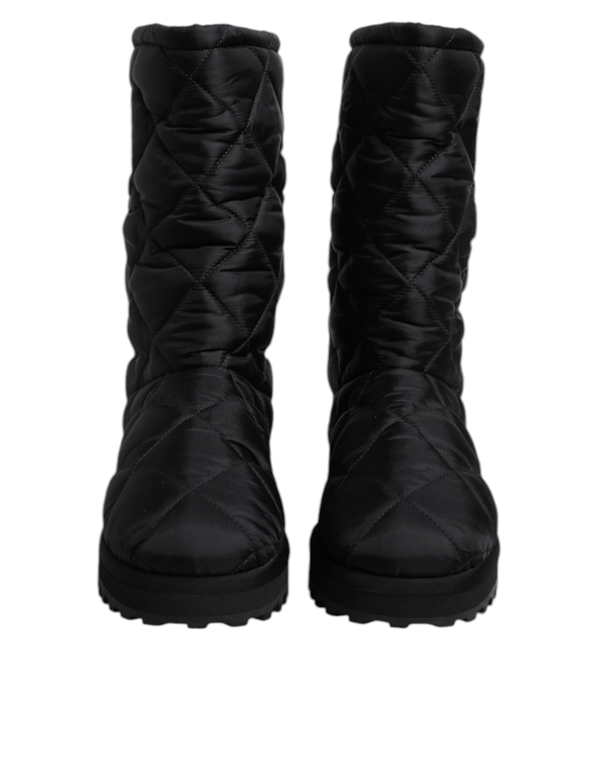 Elevate your winter wardrobe with Dolce & Gabbana's Black Polyester Padded Mid Calf Boots, where exquisite Italian craftsmanship meets timeless luxury for the discerning individual.