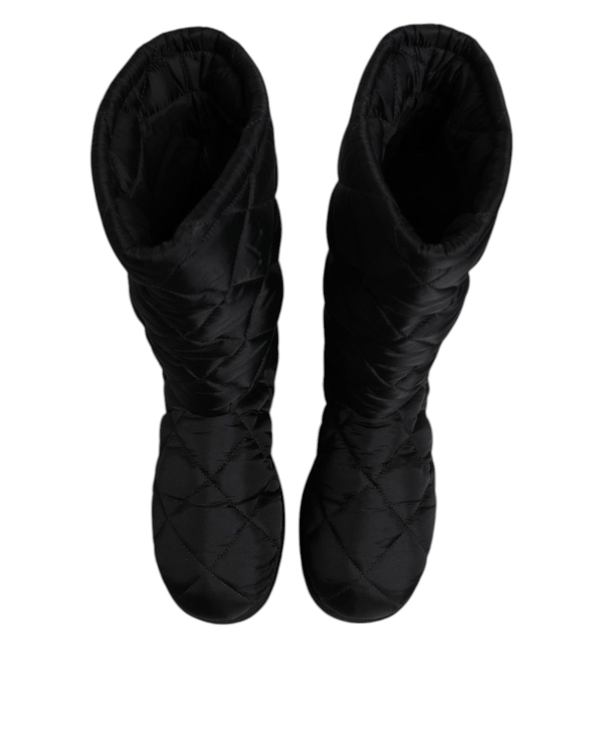 Elevate your winter wardrobe with Dolce & Gabbana's Black Polyester Padded Mid Calf Boots, a luxurious blend of comfort and sophistication, crafted in Italy for the discerning individual.