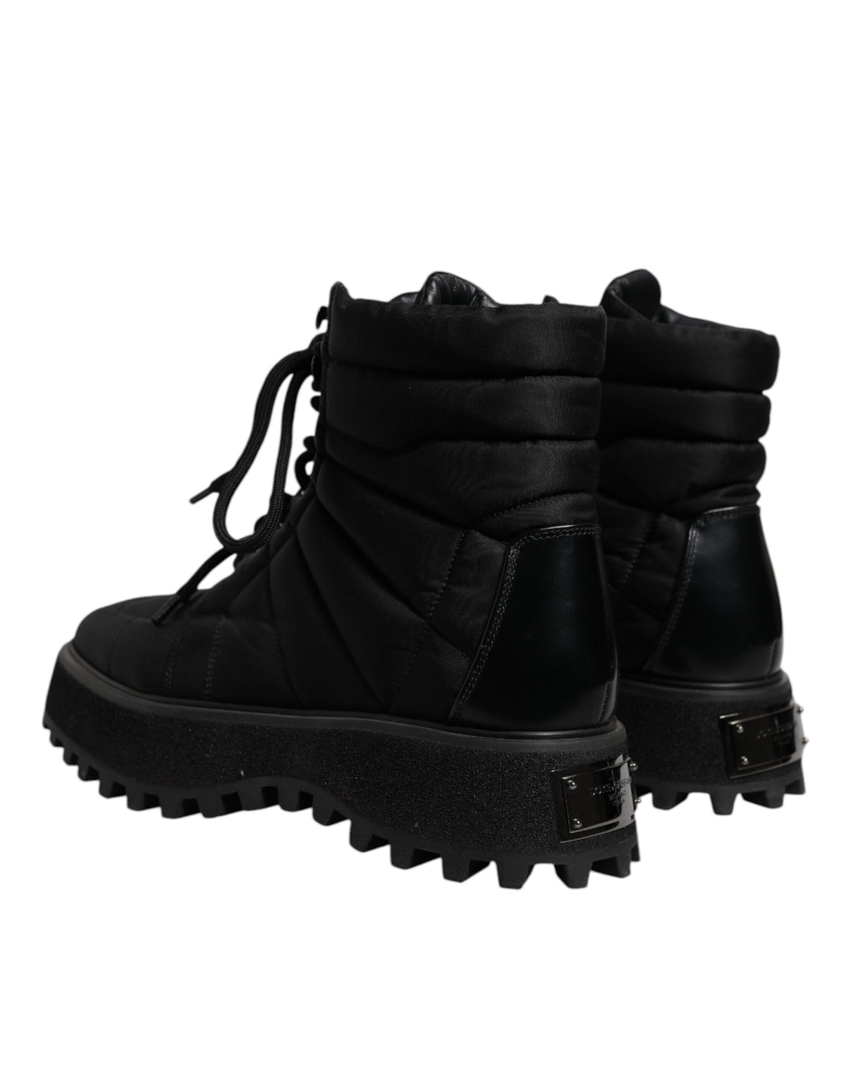 Experience the exquisite Dolce & Gabbana Black Padded Mid Calf Lace Up Boots, a luxurious blend of craftsmanship and style, perfect for the discerning individual.