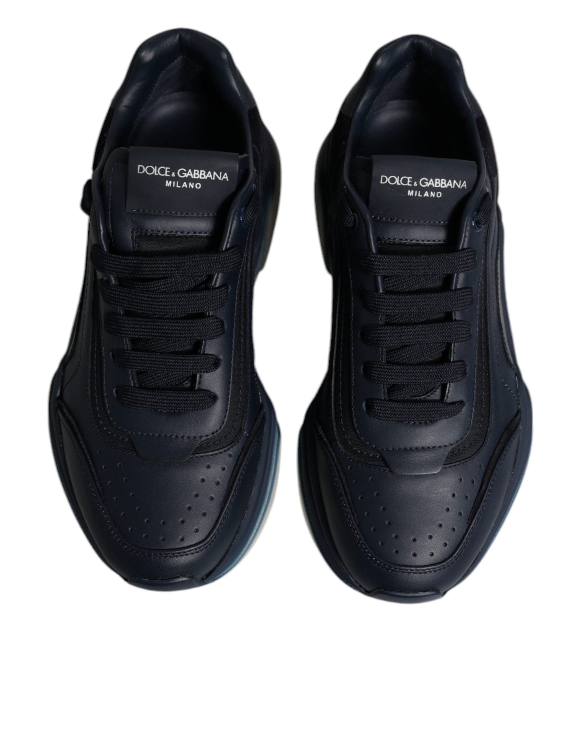 Step into sophistication with Dolce & Gabbana's Navy Blue Daymaster Low Top Sneakers, crafted from premium calf leather and nylon, embodying modern luxury for the discerning individual.