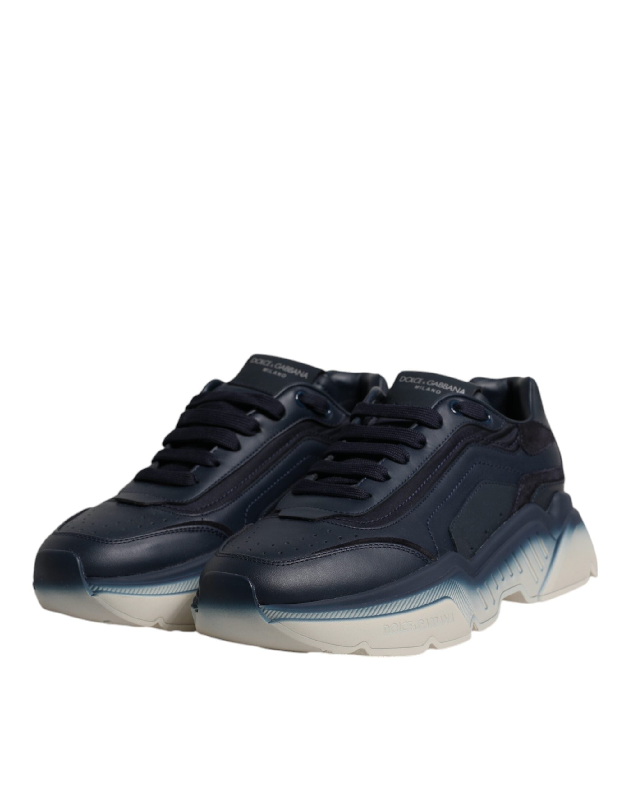 Step into luxury with Dolce & Gabbana's Navy Blue Daymaster Low Top Sneakers, crafted from premium calf leather and nylon, embodying timeless elegance and sophistication.