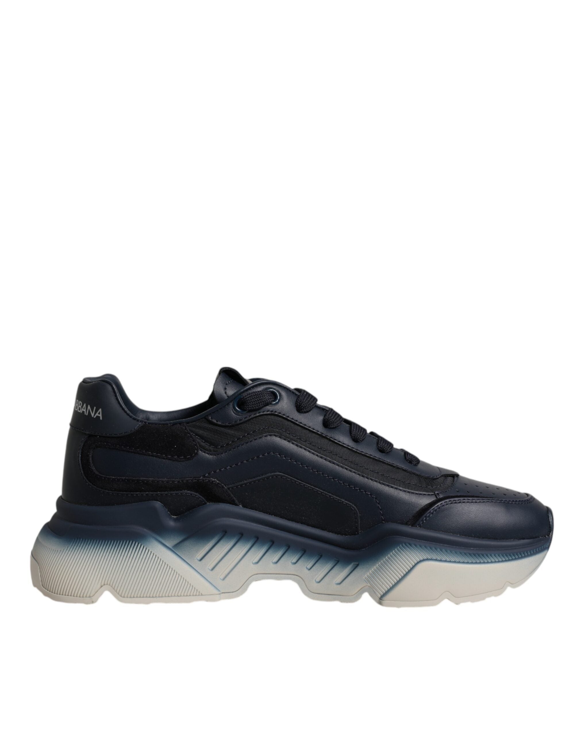 Experience the allure of Dolce & Gabbana's Navy Blue Daymaster Low Top Sneakers, crafted from premium calf leather and nylon, embodying modern luxury and timeless elegance.