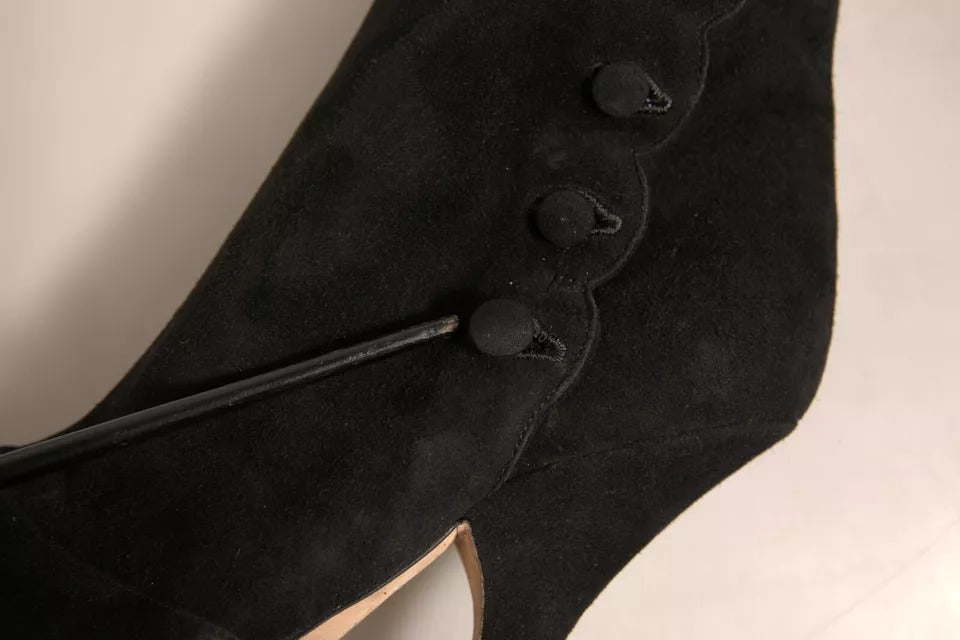 Experience the exquisite allure of Dolce & Gabbana Black Suede Heels Knee High Boots, where luxurious craftsmanship meets timeless sophistication for the discerning individual.
