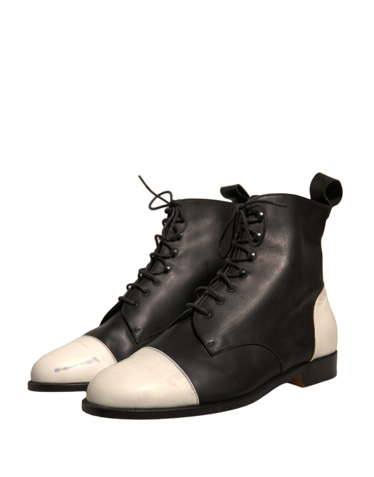 Elevate your style with Sergio Rossi's Black White Leather Lace Up Ankle Boots, a testament to Italian craftsmanship and timeless elegance, perfect for any sophisticated ensemble.
