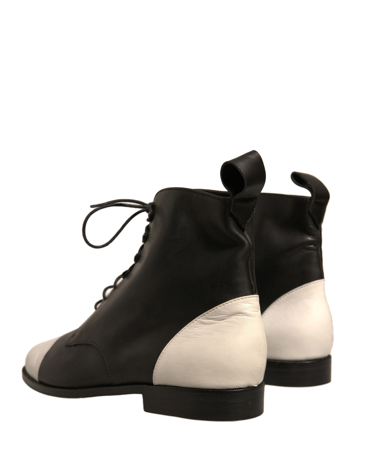 Elevate your style with Sergio Rossi's Black White Leather Lace Up Ankle Boots, a masterpiece of Italian craftsmanship that embodies timeless elegance and sophistication.