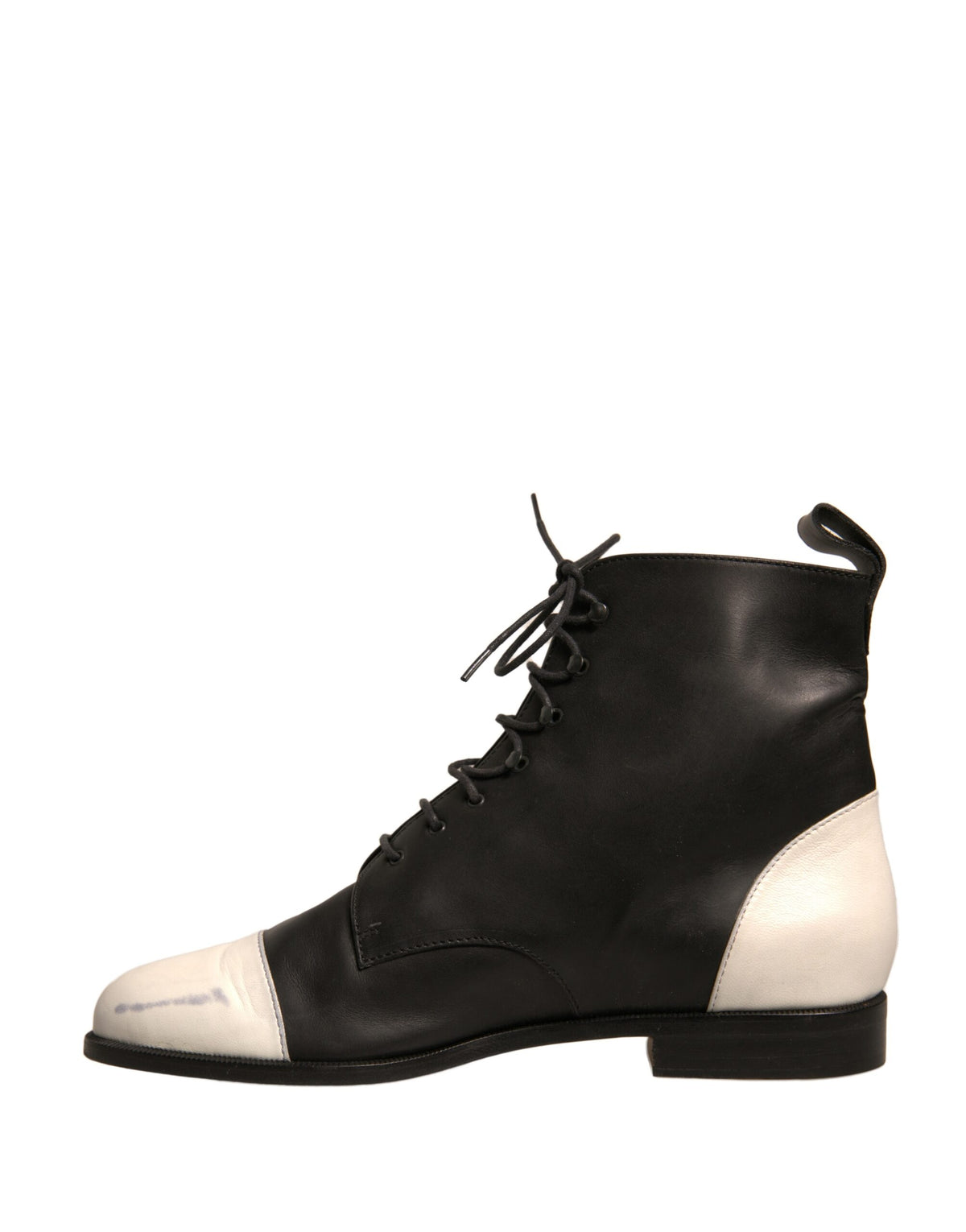Elevate your style with Sergio Rossi's Black White Leather Lace Up Ankle Boots, a masterpiece of Italian craftsmanship that embodies timeless elegance and sophistication.