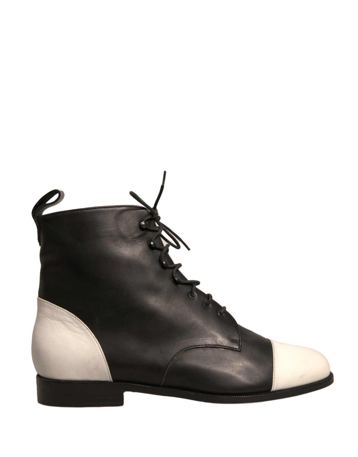Elevate your style with Sergio Rossi's Black White Leather Lace Up Ankle Boots, a masterpiece of Italian craftsmanship that embodies timeless elegance and sophisticated allure.