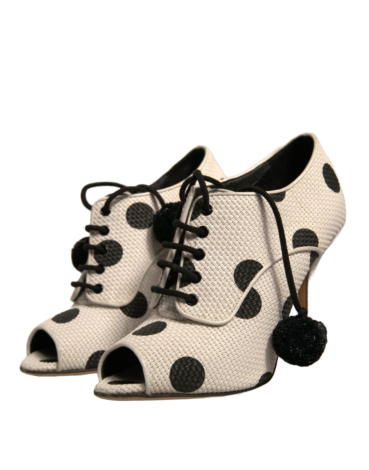 Elevate your style with Dolce & Gabbana's White Black Polka Dot Peep Toe Ankle Boots, where luxurious leather meets playful elegance, embodying timeless sophistication.