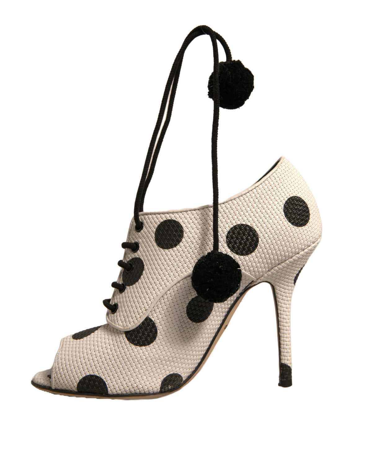 Step into refined elegance with Dolce & Gabbana's White Black Polka Dot Peep Toe Ankle Boots, where luxurious leather meets playful artistry for timeless allure.