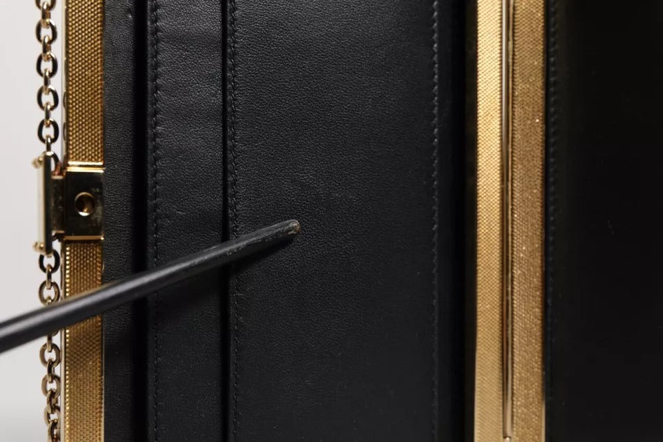 Indulge in the exquisite Dolce & Gabbana Purple Leather Clutch, a handcrafted masterpiece that elevates your evening attire with luxurious elegance and timeless allure.