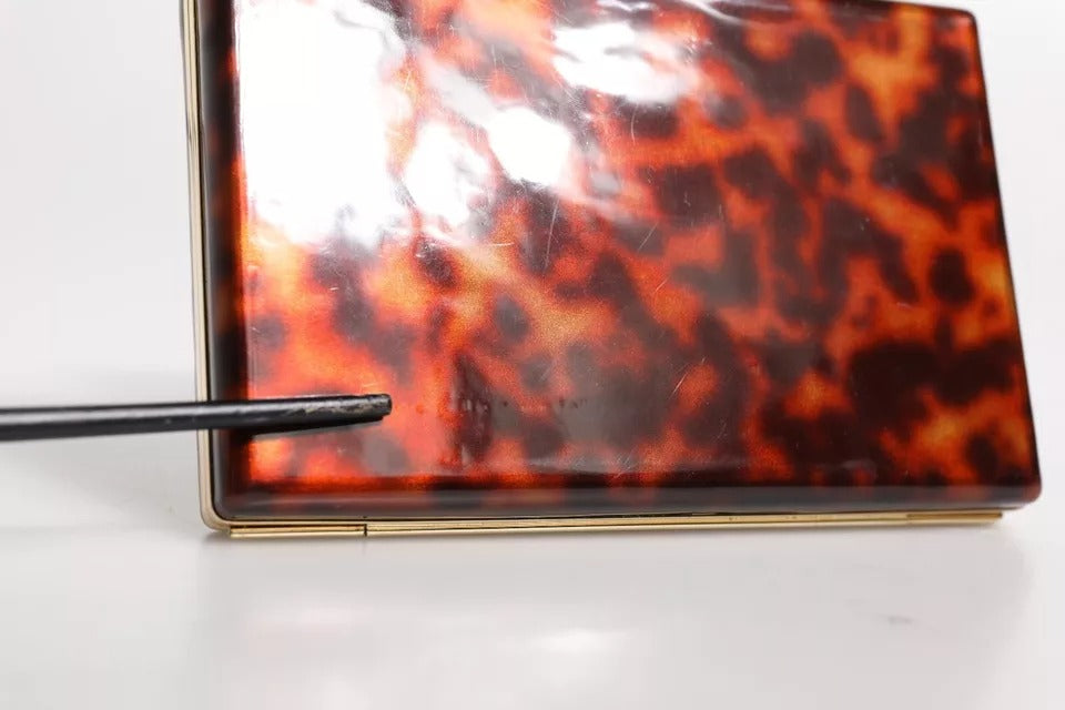 Elevate your evening allure with the Dolce & Gabbana Brown Leather Clutch, a vintage masterpiece of Italian craftsmanship that embodies timeless elegance and sophistication.