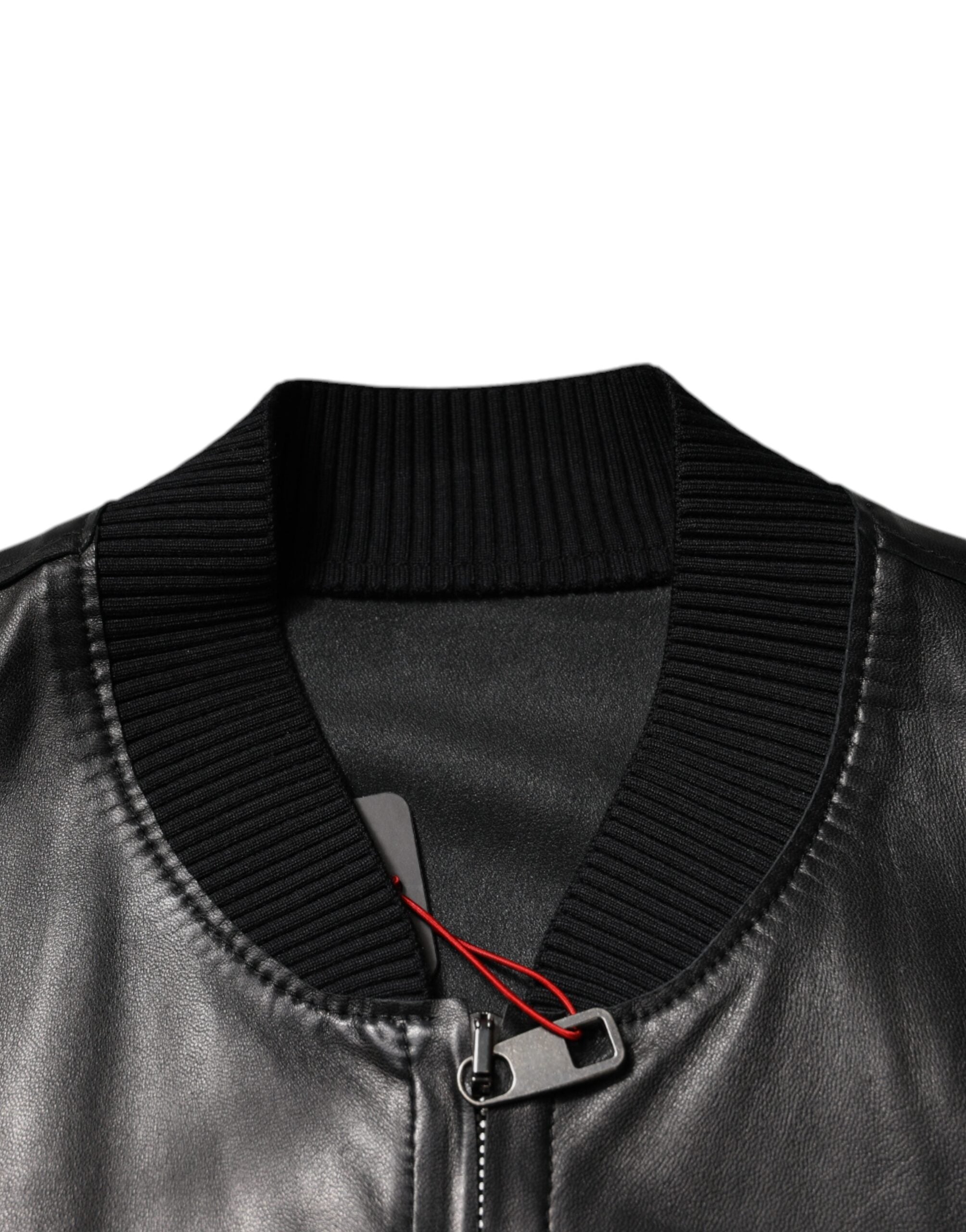 Indulge in the exquisite allure of the Dolce & Gabbana Black Lambskin Full Zip Biker Blouson Jacket, a masterpiece of Italian craftsmanship that elevates any ensemble.