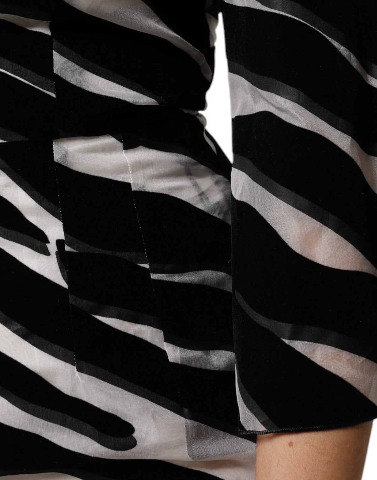 Elevate your elegance with the Dolce & Gabbana Black White Zebra A-line Sheath Mini Dress, a luxurious blend of silk and nylon that embodies timeless sophistication and exquisite craftsmanship.