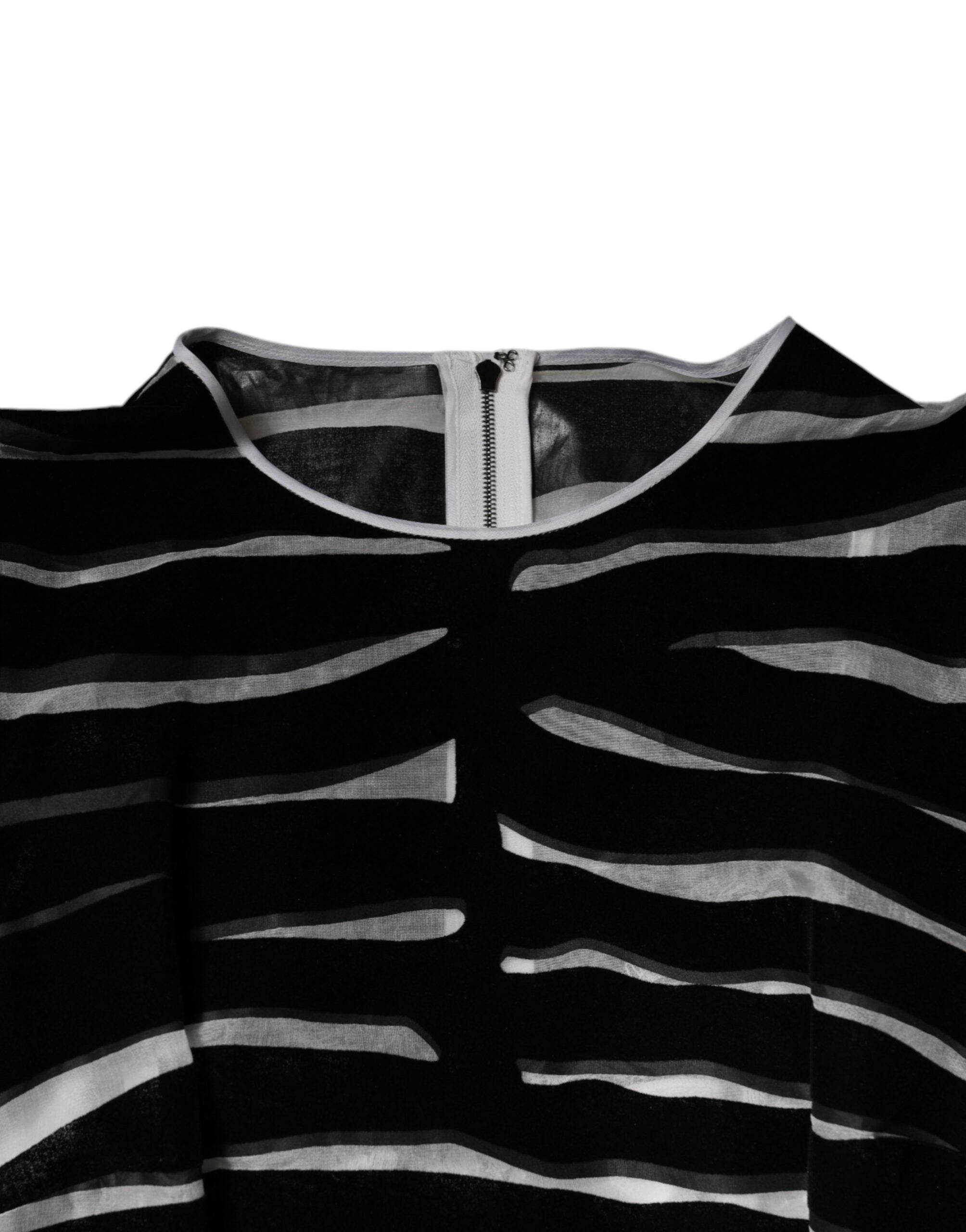 Experience the allure of Dolce & Gabbana's Black White Zebra A-line Sheath Mini Dress, a masterpiece of silk and nylon that embodies luxury and sophisticated elegance.