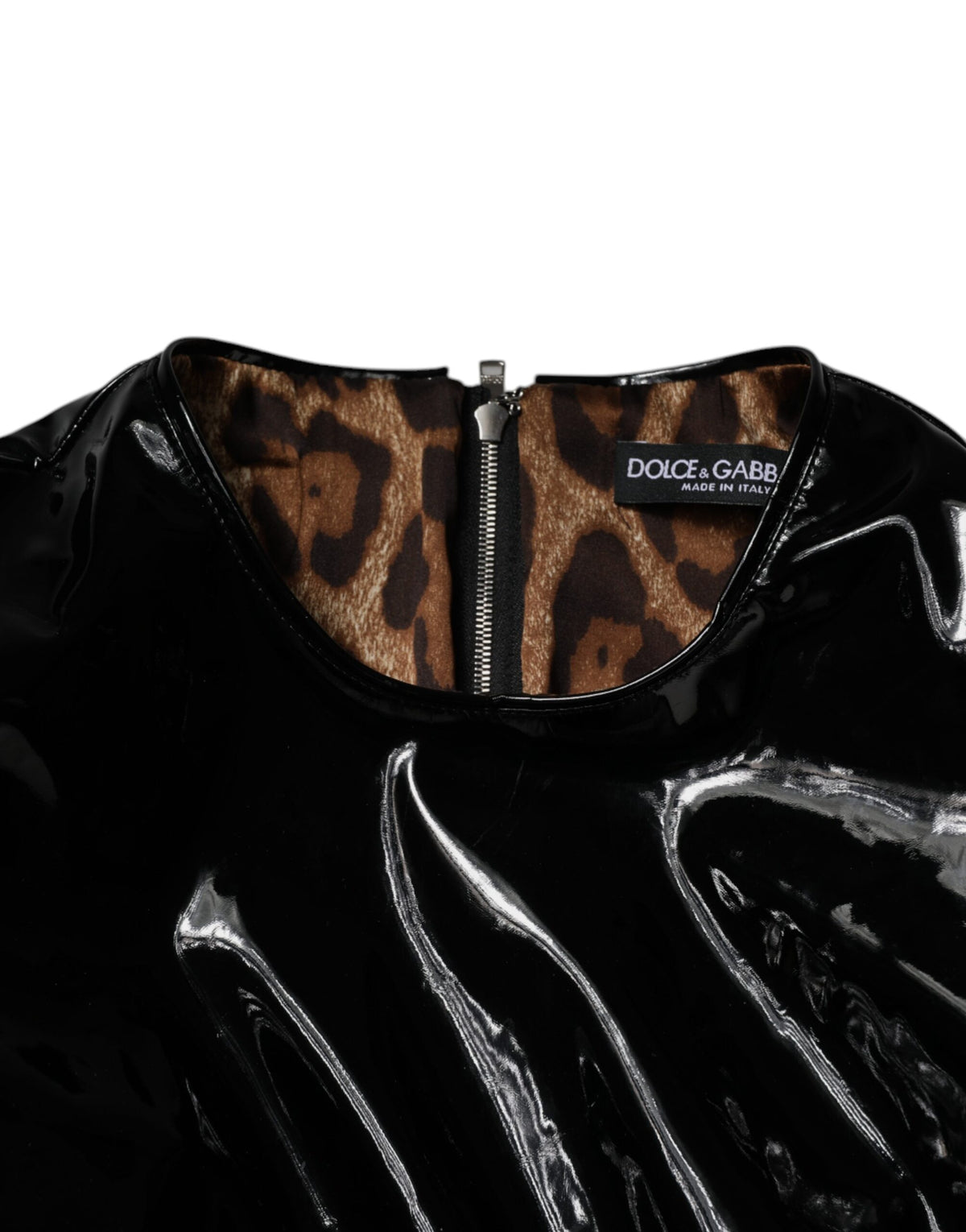 Elevate your wardrobe with the Dolce & Gabbana Black Patent Leather Puff Sleeves Mini Dress, a luxurious blend of 56% polyurethane and 44% polyester, embodying timeless Italian craftsmanship and haute couture elegance.