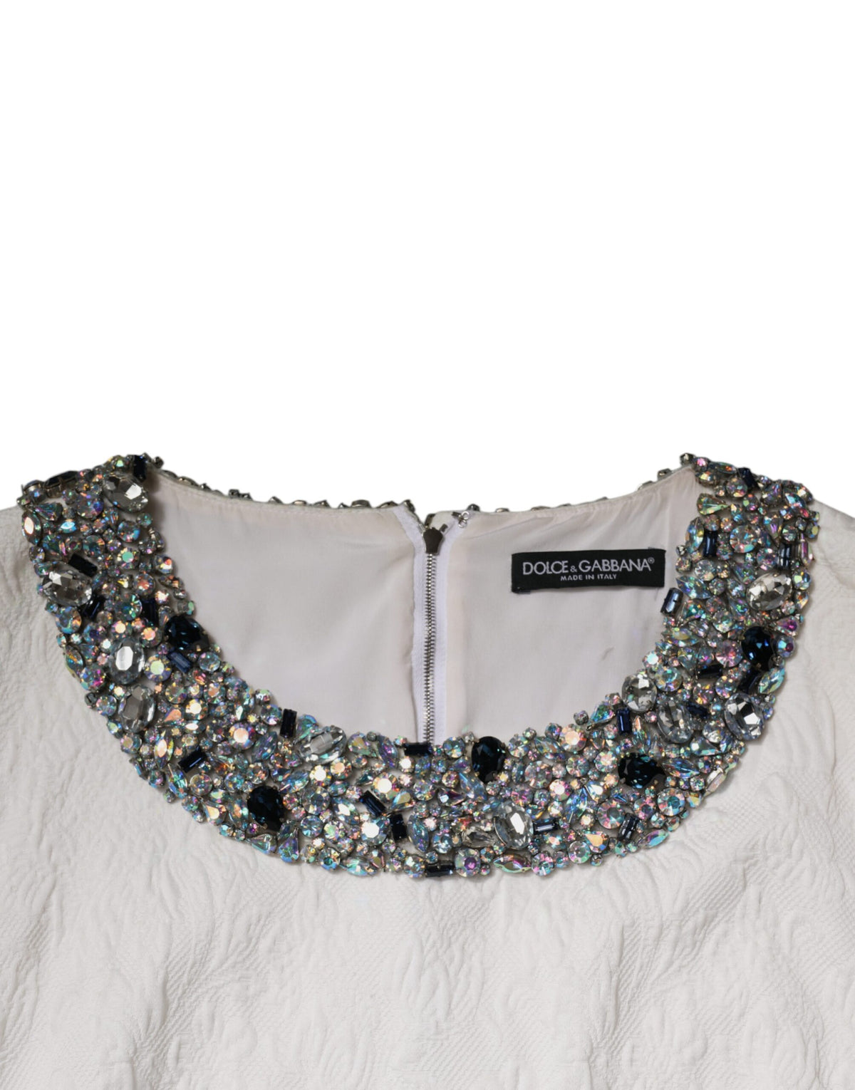 Indulge in the exquisite Dolce & Gabbana White Crystal Embellished Jacquard Brocade Mini Dress, a masterpiece of Italian craftsmanship that embodies timeless elegance and sophistication.