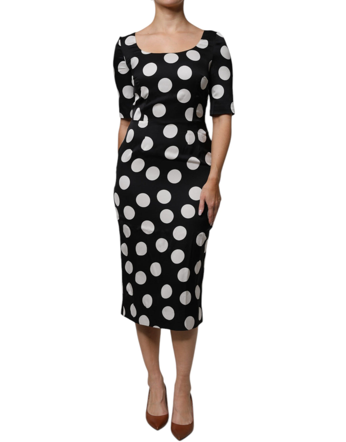 Elevate your elegance with the Dolce & Gabbana Black White Silk Polka Dots Sheath Midi Dress, a luxurious blend of silk and artistry, perfect for any sophisticated occasion.