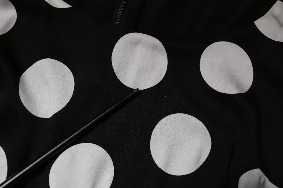 Indulge in the exquisite Dolce & Gabbana Black White Silk Polka Dots Sheath Midi Dress, a timeless masterpiece that embodies elegance and sophistication for any occasion.
