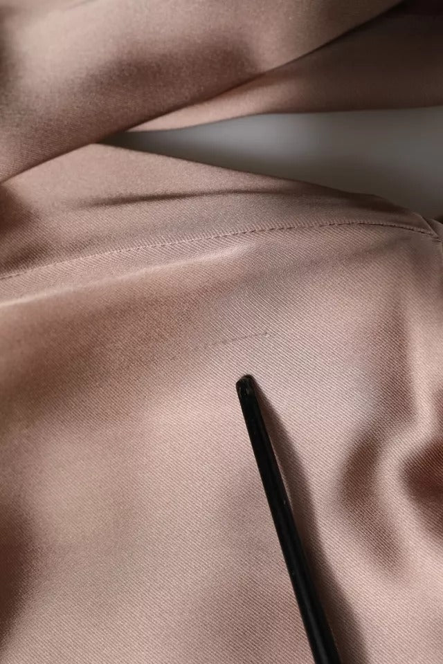 Indulge in the exquisite Emporio Armani Pink Satin Long Sleeves Sheath Wrap Mini Dress, where luxurious craftsmanship meets timeless elegance, perfect for any sophisticated occasion.