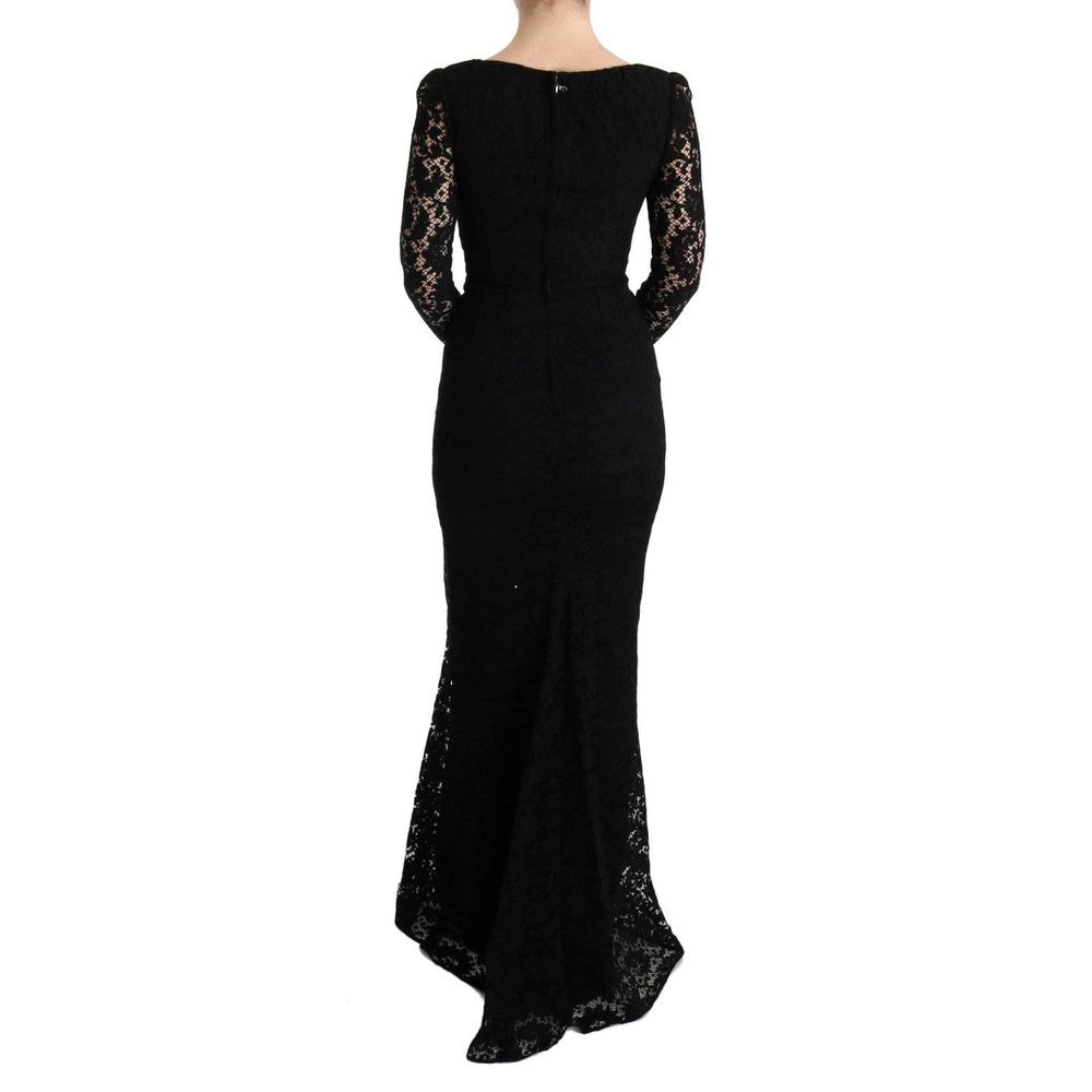 Elevate your elegance with the Dolce & Gabbana Black Cotton Cocktail Dress, a luxurious blend of exquisite floral lace and impeccable craftsmanship, perfect for unforgettable soirées.
