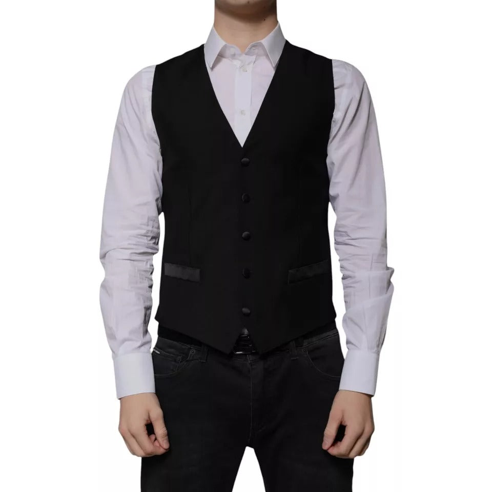 Indulge in the exquisite Dolce & Gabbana Black Wool Formal Dress Waistcoat Vest, where luxurious virgin wool and silk meet unparalleled Italian craftsmanship, elevating your style with timeless elegance.