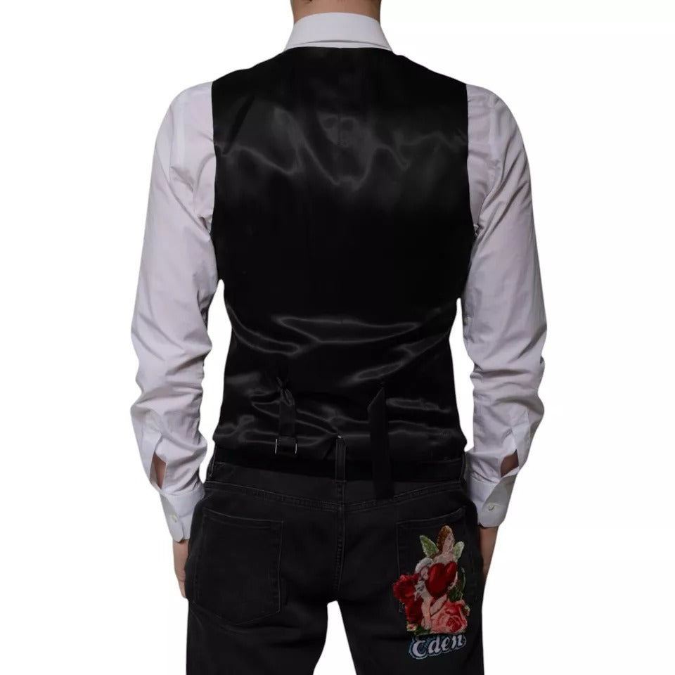 Indulge in the exquisite Dolce & Gabbana Black Wool Formal Dress Waistcoat Vest, a masterful blend of virgin wool and silk, embodying timeless elegance and sophistication for the discerning individual.