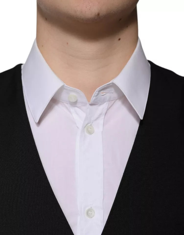Indulge in the exquisite Dolce & Gabbana Black Wool Formal Dress Waistcoat Vest, a masterful blend of virgin wool and silk, embodying timeless elegance and refined sophistication.