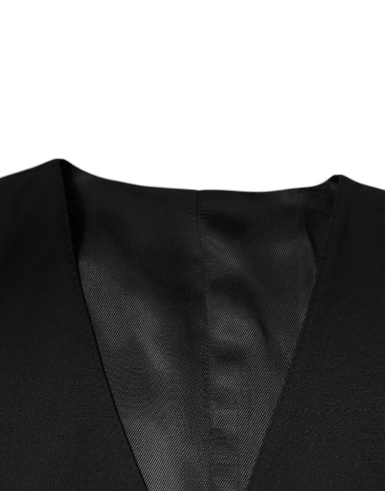 Indulge in the exquisite Dolce & Gabbana Black Wool Formal Dress Waistcoat Vest, a masterpiece of Italian craftsmanship, blending luxury materials for timeless elegance.