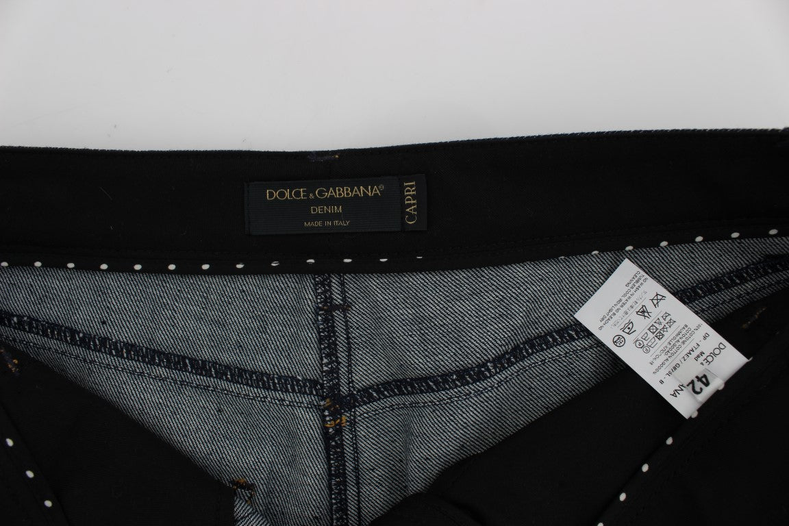 Indulge in the exquisite allure of Dolce & Gabbana Blue Denim Cotton CAPRI Torero Jeans, where unparalleled Italian craftsmanship meets timeless elegance, elevating your style to new heights.