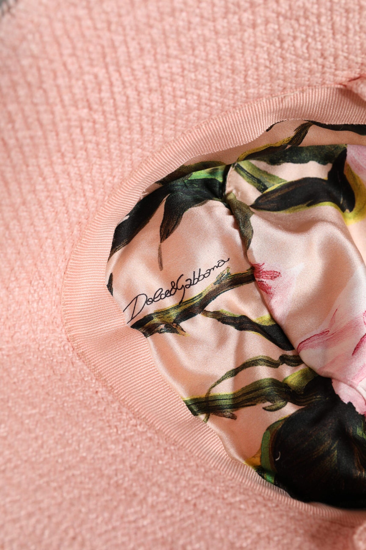 Elevate your summer style with the Dolce & Gabbana Pink Cotton Wide Brim Bucket Hat, a luxurious blend of craftsmanship and elegance, perfect for sunlit sophistication.