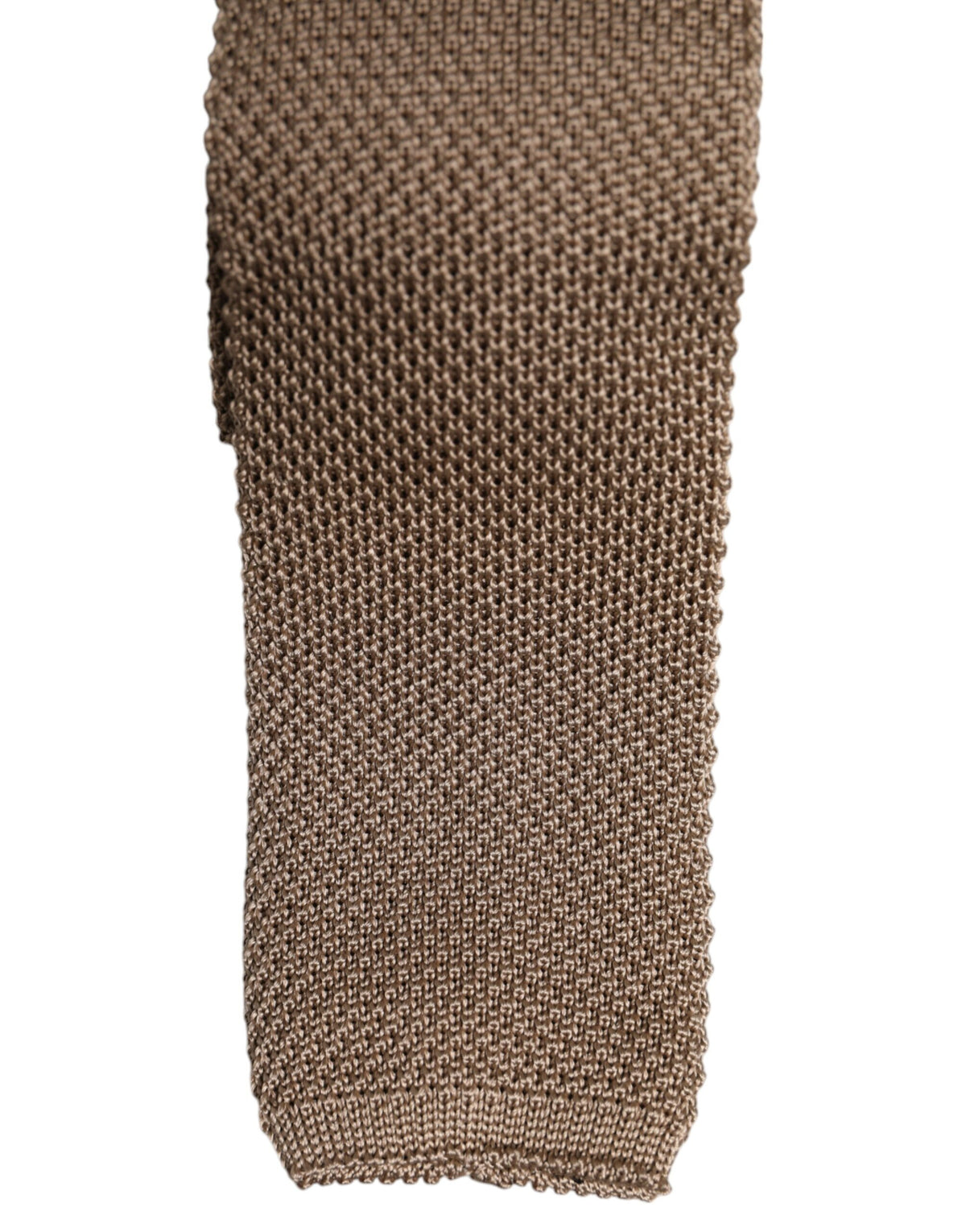 Indulge in the exquisite Dolce & Gabbana Brown Silk Adjustable Necktie, a timeless accessory that embodies sophistication and elegance for the discerning individual.