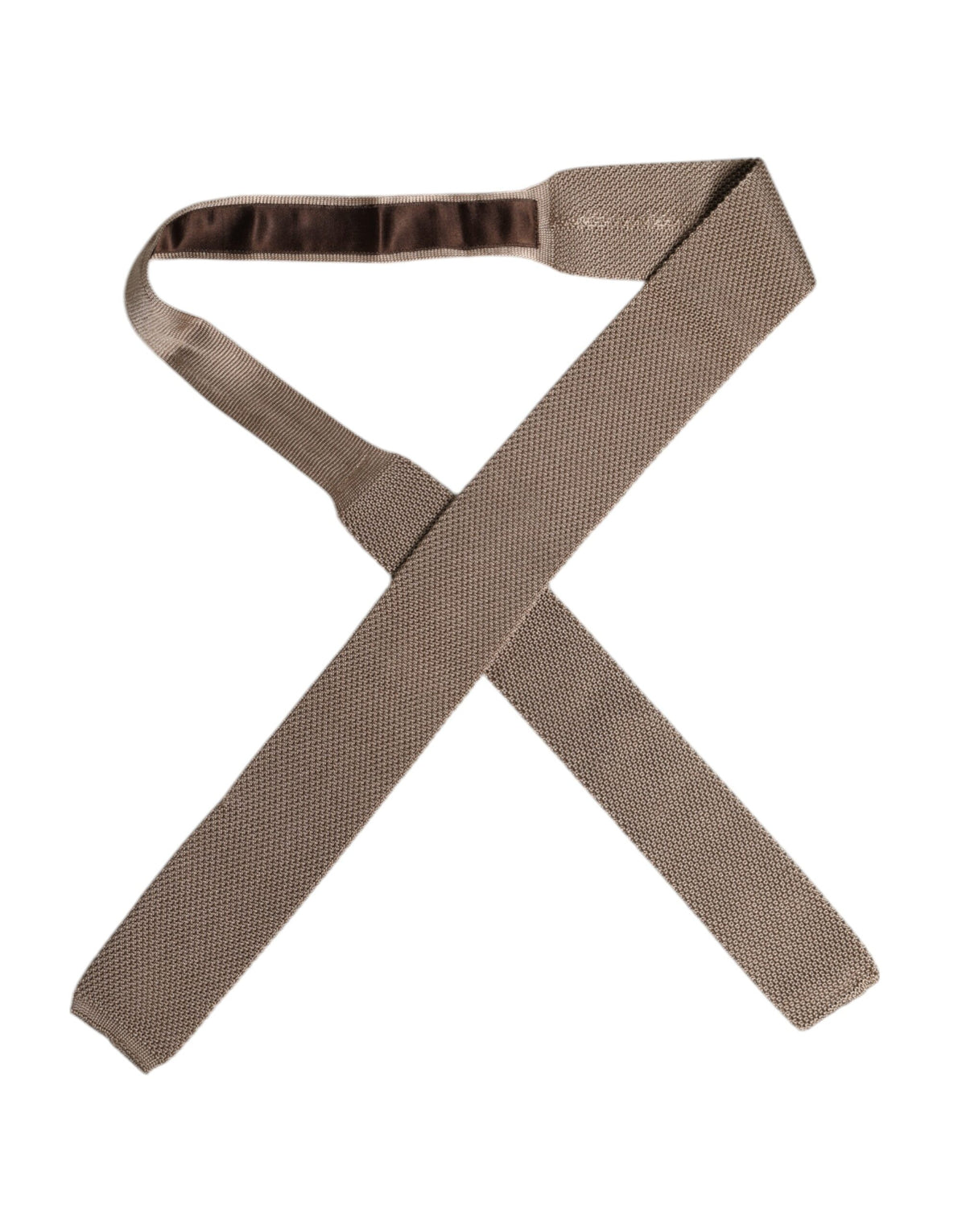 Indulge in the exquisite Dolce & Gabbana Brown Silk Adjustable Necktie, a symbol of refined elegance and craftsmanship, perfect for the discerning individual.