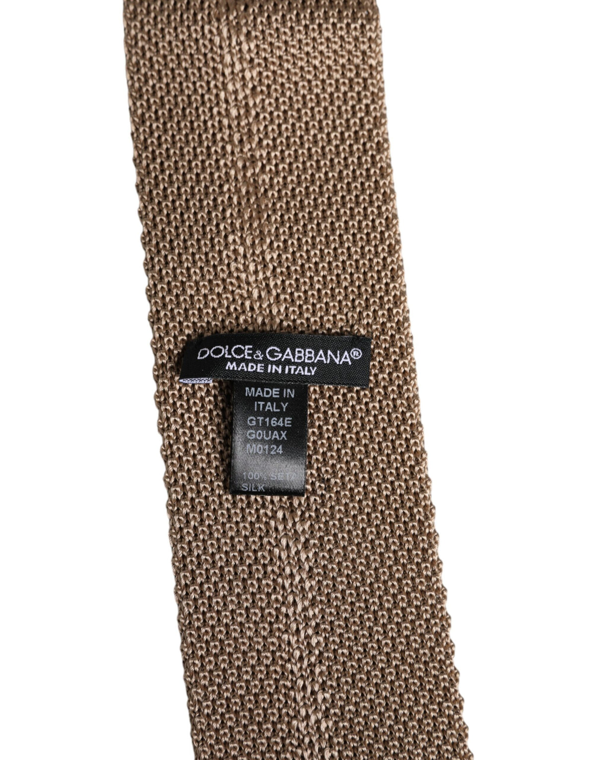 Indulge in the exquisite Dolce & Gabbana Brown Silk Adjustable Necktie, a symbol of timeless elegance and sophisticated craftsmanship, perfect for the discerning individual.